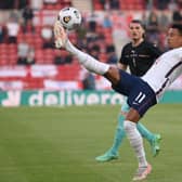 Jesse Lingard of England controls the ball during the international friendly match between England and Austria at Riverside Stadium.