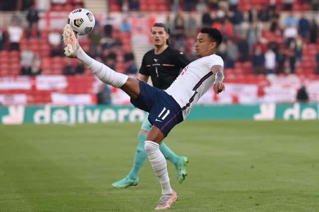 Jesse Lingard of England controls the ball during the international friendly match between England and Austria at Riverside Stadium.