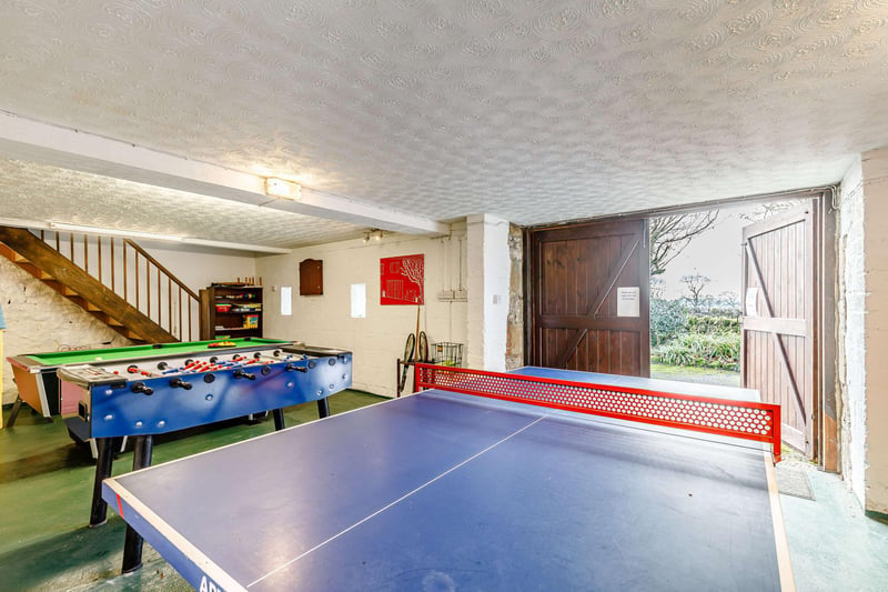 A family games room is located between two of the cottages