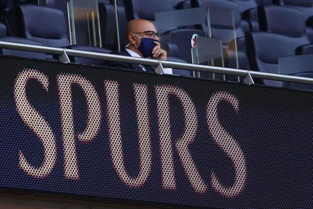 Daniel Levy , chairman of Tottenham looks on from the stands while wearing a face mask.