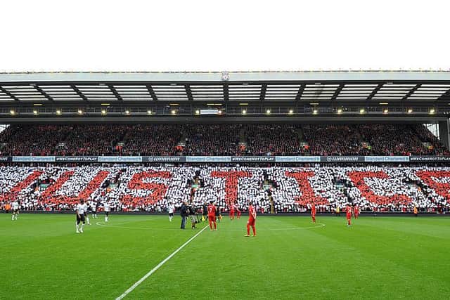 Tributes are paid to victims of the Hillsborough disaster as mosaics are formed by supporters around Anfield.