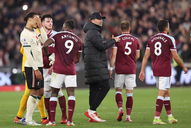 Jurgen Klopp pats the back of Vladimir Coufal of West Ham United after the Premier League match between West Ham United and Liverpool at London Stadium on November 07, 2021 in London, England. (Photo by Alex Pantling/Getty Images)
