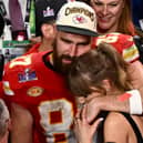 Sideline show: US singer-songwriter Taylor Swift and Kansas City Chiefs' tight end #87 Travis Kelce embrace after the Chiefs won Super Bowl LVIII against the San Francisco 49ers (Picture: PATRICK T. FALLON/AFP via Getty Images)