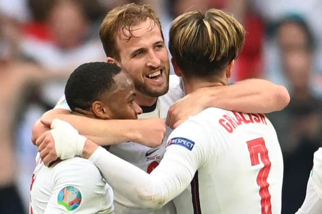 Harry Kane celebrates with Raheem Sterling and Jack Grealish. (Photo by Andy Rain / POOL / AFP) (Photo by ANDY RAIN/POOL/AFP via Getty Images)