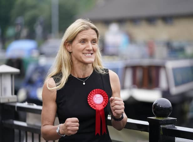Kim Leadbeater celebrates by a canal in Huddersfield after winning the Batley and Spen by-election. Photo: Danny Lawson/PA Wire