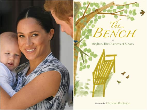 Meghan Markle, pictured holding her son Archie, has written her first children's book called The Bench (Getty).