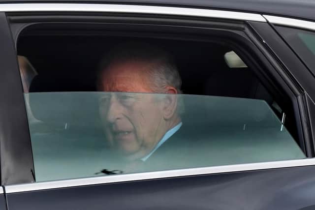 King Charles III is driven by car from Clarence House, his London home, along The Mall towards Buckingham Palace.