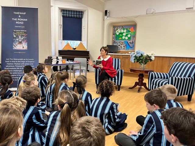 Lyon introducing Timewaif & The Roman Road to pupils during a school reading event in Cumbria.