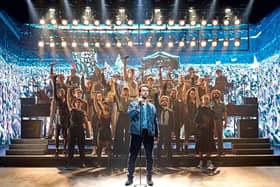 Craige Els as Bob Geldof and the original cast of Just For One Day: The Live Aid Musical