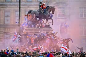 Rangers fans celebrate winning the Scottish Premiership title at George Square, Glasgow, on May 15, 2021.