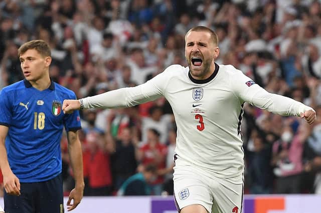 Luke Shaw celebrates after scoring the opening goal during the UEFA EURO 2020 final football match between Italy and England at the Wembley Stadium in London on July 11, 2021. (Photo by Andy Rain / POOL / AFP)