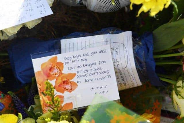 Tributes to Jordan have been left at the park where he was playing football. One reads "sleep tight and god bless you little man".
