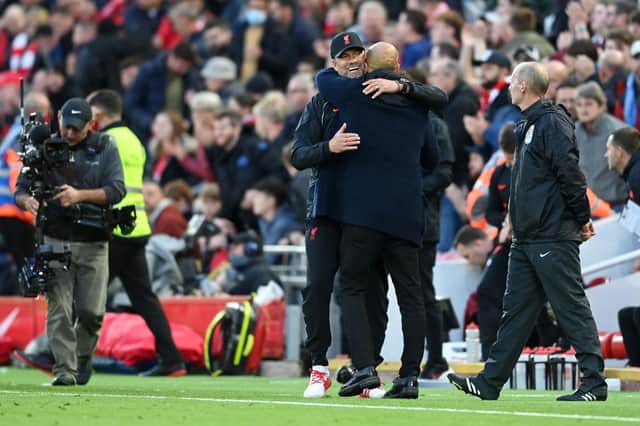 Jurgen Klopp, Manager of Liverpool embraces Pep Guardiola, Manager of Manchester City. (Photo by Michael Regan/Getty Images)