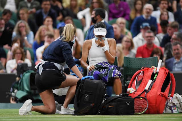 Following the conclusion of the third game of the second set of Emma Raducanu's fourth round match with Ajla Tomljanovic, the young Brit sought medical attention on court. (Pic: Getty)