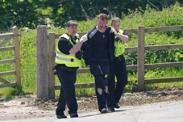 Boulton was led away by police, following an overnight search for the murder suspect (Picture: PA)