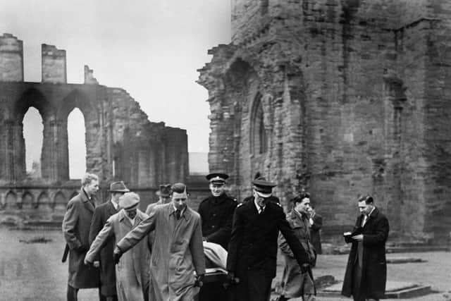 The Stone of Scone - the Scottish Stone of Destiny - missing from Westminster Abbey since Christmas Day, 1950 - being removed from Abroath Abbey, Forfarshire, Scotland after being handed to the Custodian of the Abbey James Wiseheart by Scottish Nationalists