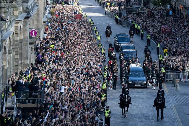 Crowd line the Royal Mile for the procession of the coffin of Elizabeth II from the Palace of Holyroodhouse to St Giles' Cathedral. PIC: Oli Scarff/Getty.