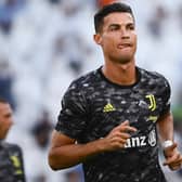 Juventus' Portuguese forward Cristiano Ronaldo jogs during the warm up before the start of the friendly football match between Juventus and Atalanta at the Allianz Stadium in Turin, northern Italy on August 14, 2021. (Photo by MARCO BERTORELLO / AFP) (Photo by MARCO BERTORELLO/AFP via Getty Images)