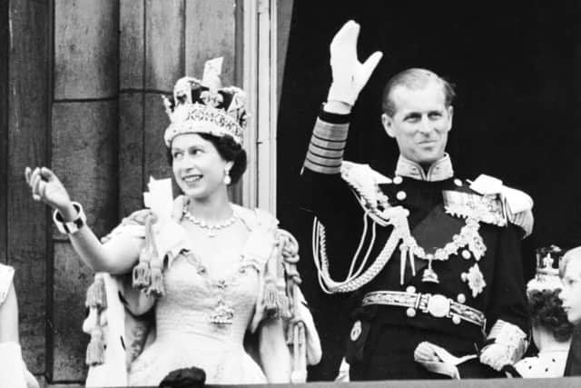 The Queen and Prince Philip wave to the crowd following her coronation at Westminster Abbey on 2 June, 1953 (Picure: INTERCONTINENTALE/AFP via Getty Images)