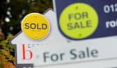 Property sold and for sale signs. Photo: Andrew Matthews/PA Wire