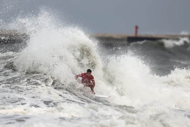 Lucca Mesinas of Team Peru surfs during the men's round 3 heat on day three of the Tokyo 2020 Olympic Games (Photo by Ryan Pierse/Getty Images)