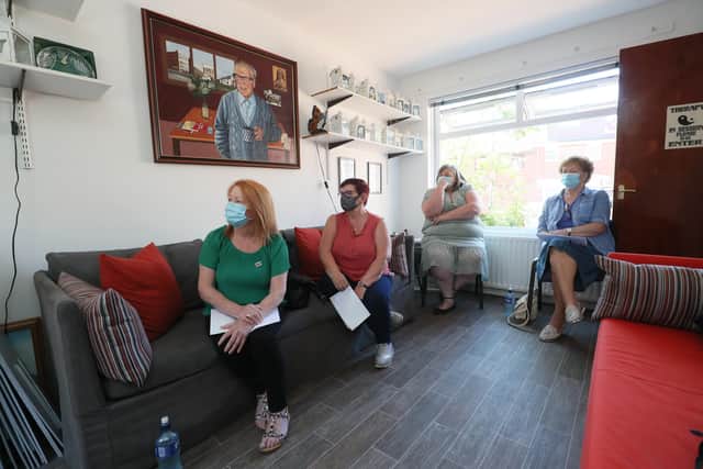 Family members of Ballymurphy massacre victims (left to right) Eileen McKeown, daughter of Joseph Cor, Mary Corr, daughter in law of Joseph Corr, Irene Connolly, daughter of Joan Connolly and Kathleen McCarry, sister of Edward Doherty at Springhill Community House in Belfast, watching Secretary of State for Northern Ireland Brandon Lewis announcing the government's plans to introduce legislation to end all prosecutions related to the Northern Ireland Troubles before 1998 (PA)