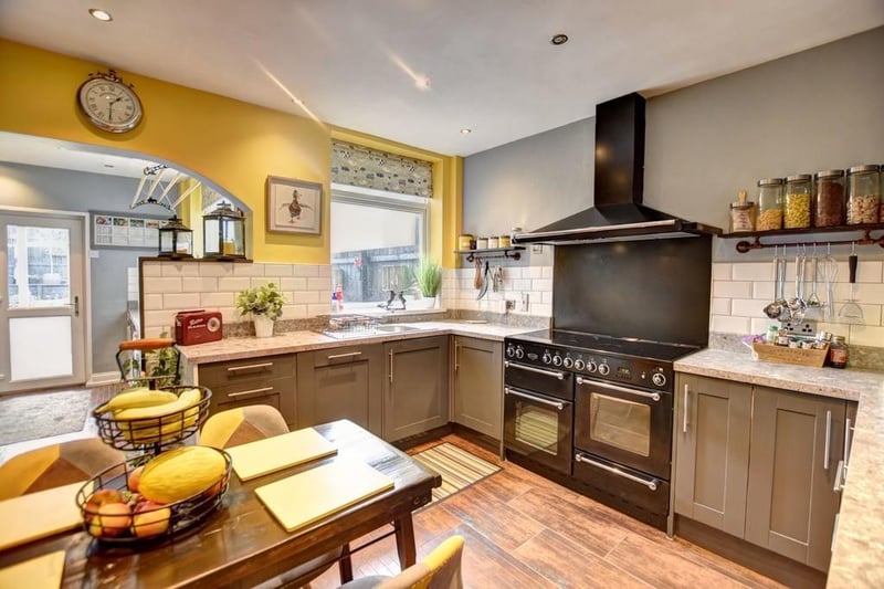 The kitchen is fitted with a range of appliances and has ample working surface.