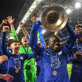 Chelsea's French midfielder N'Golo Kante (C) lifts the trophy after winning the UEFA Champions League final football match between Manchester City and Chelsea FC at the Dragao stadium in Porto on May 29, 2021. (Photo by DAVID RAMOS/POOL/AFP via Getty Images)