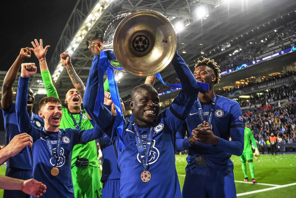 Chelsea's French midfielder N'Golo Kante (C) lifts the trophy after winning the UEFA Champions League final football match between Manchester City and Chelsea FC at the Dragao stadium in Porto on May 29, 2021. (Photo by DAVID RAMOS/POOL/AFP via Getty Images)
