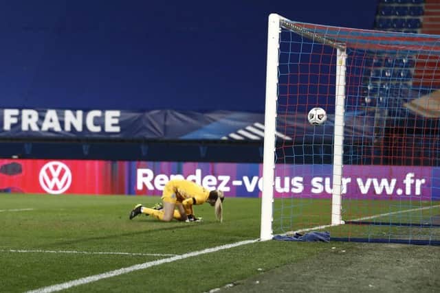 England's goalkeeper Ellie Roebuck fails to stop an effort from going in against France.