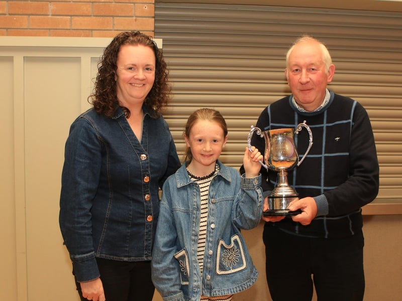 Geraldine McElduff, Countryside Services, with her daughter Molly, presenting Robert Forde with the William Black Memorial Perpetual Cup for Male Champion at Balmoral Show with Mullyknock Scorpio.