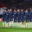 LONDON, ENGLAND - OCTOBER 12: Players of England line up for the national anthem prior to the 2022 FIFA World Cup Qualifier match between England and Hungary at Wembley Stadium on October 12, 2021 in London, England. (Photo by Julian Finney/Getty Images)