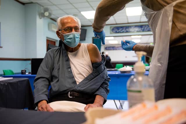 A man receiving an injection of the Oxford/AstraZeneca coronavirus vaccine at the Al Abbas Mosque in Birmingham, which is being used as a Covid-19 vaccination centre (Photo: PA Wire/PA Images)