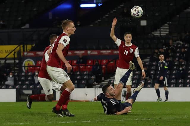 ohn McGinn’s superb overhead kick rescued a point for Scotland in the 85th minute of their opening World Cup qualifier against Austria