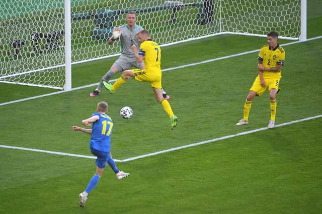 Oleksandr Zinchenko scores Ukraine's first goal in their last 16 clash against Sweden.