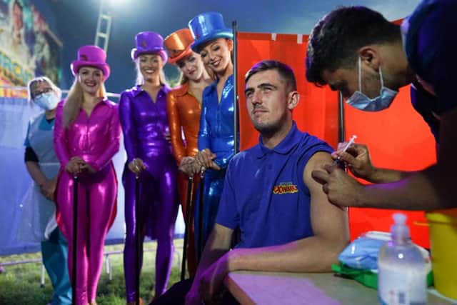 Circus performers look on at a new ‘Pop Up’ vaccination centre in the Big Top of Circus Extreme in Shibden Park in Halifax (Photo: Ian Forsyth/Getty Images)