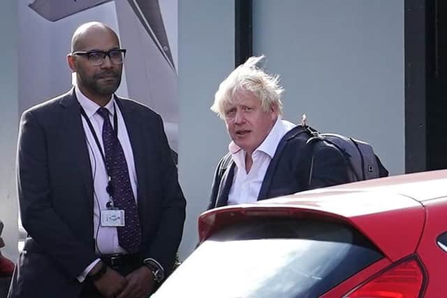 Former Prime Minister Boris Johnson arrives at Gatwick Airport in London, after travelling on a flight from the Caribbean, following the resignation of Liz Truss as Prime Minister.