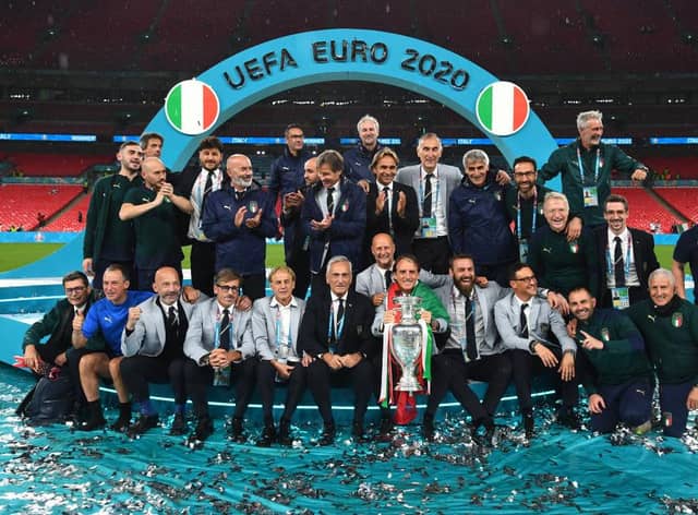 Roberto Mancini and the backroom staff celebrate with The Henri Delaunay Trophy following his team's victory in the UEFA Euro 2020 Championship Final between Italy and England at Wembley Stadium (Picture: Getty Images)