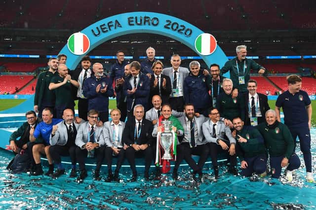Roberto Mancini and the backroom staff celebrate with The Henri Delaunay Trophy following his team's victory in the UEFA Euro 2020 Championship Final between Italy and England at Wembley Stadium (Picture: Getty Images)