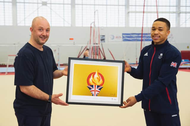 British gymnast Joe Fraser presents gymnastics coach Lee Woolls with a painting created by artist Henry Fraser as part of the Purplebricks Team GB Home Support Campaign, a strong initiative commissioning three artists from the sporting world to produce exclusive paintings to celebrate Team GB.