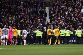 Stewards and police officers attempt to stop a pitch invasion during the FA Cup match between West Bromwich Albion and Wolverhampton Wanderers at The Hawthorns. (Picture: Jack Thomas - WWFC/Wolves via Getty Images)