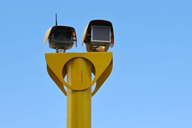 A pensioner has been arrested for cutting down a speed camera in Wigan