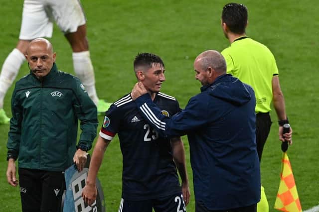 Scotland's midfielder Billy Gilmour and coach Steve Clarke hug after the England game on Friday night.