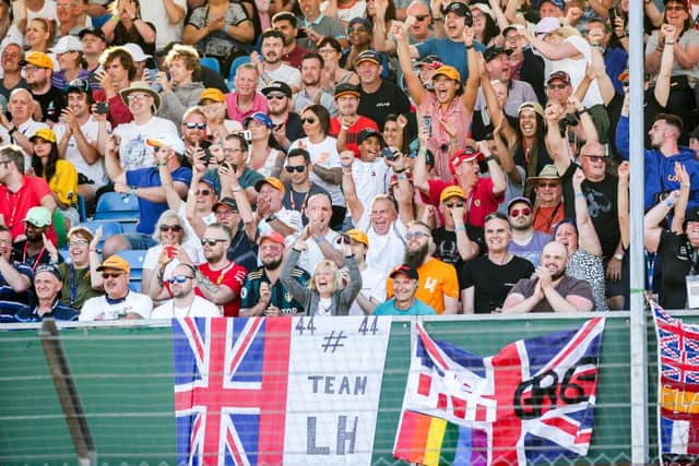 Fans of Lewis Hamilton celebrate him taking Pole Position during practice/qualifying ahead of the F1 Grand Prix of Great Britain at Silverstone on July 16, 2021 in Northampton, England. (Photo by Peter Fox/Getty Images)