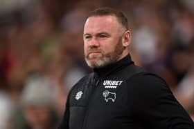 DERBY, ENGLAND - APRIL 15: Wayne Rooney, Manager of Derby County looks on prior to the Sky Bet Championship match between Derby County and Fulham at Pride Park Stadium on April 15, 2022 in Derby, England. (Photo by Nathan Stirk/Getty Images)