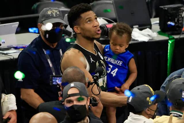 Giannis Antetokounmpo #34 with his baby son son Liam Charles Antetokounmpo after winning the 2021 NBA Finals (Picture: Getty Images)