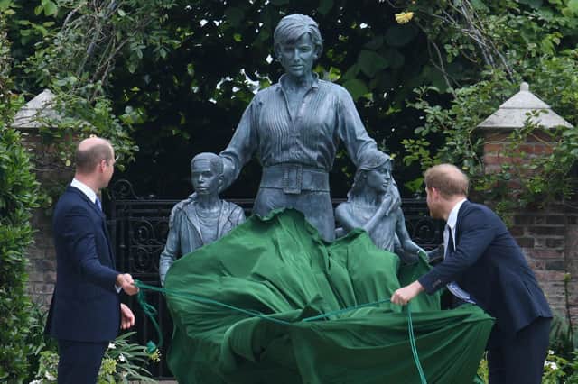 Prince William and Prince Harry unveil a statue of their mother, Princess Diana, at The Sunken Garden in Kensington Palace (AFP/Getty Images)
