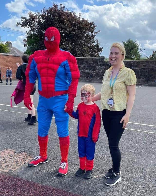 Harry with Spiderman and Stephanie Duncan, an early years officer who helped organise the celebration at Carmuirs. Pic: Contributed