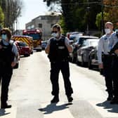 French police officials block off a street near a police station in Rambouillet, south-west of Paris, on April 23, 2021, after a woman was stabbed to death in the town (Photo by BERTRAND GUAY/AFP via Getty Images)