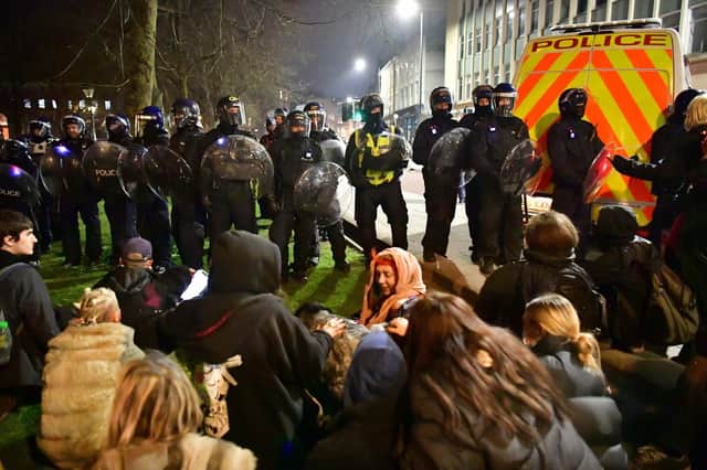 Police and protesters at College Green in Bristol where police said around 130 people had gathered earlier in the evening